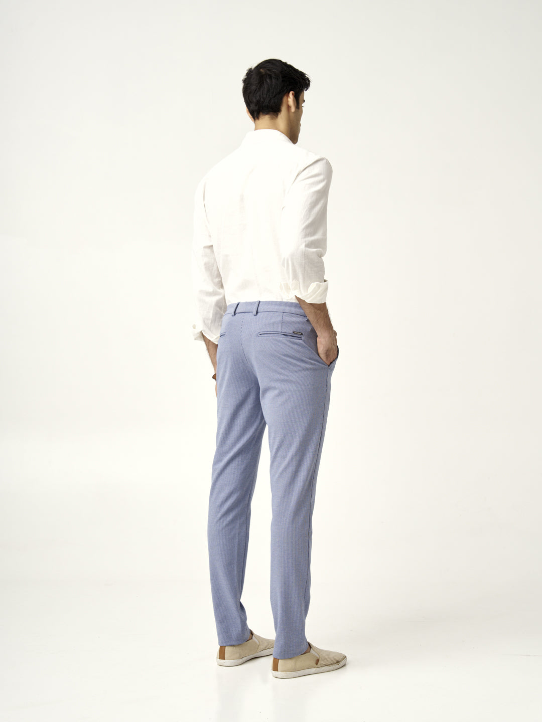 rear view of a man wearing scottish blue pants and a white shirt from the Pant Project