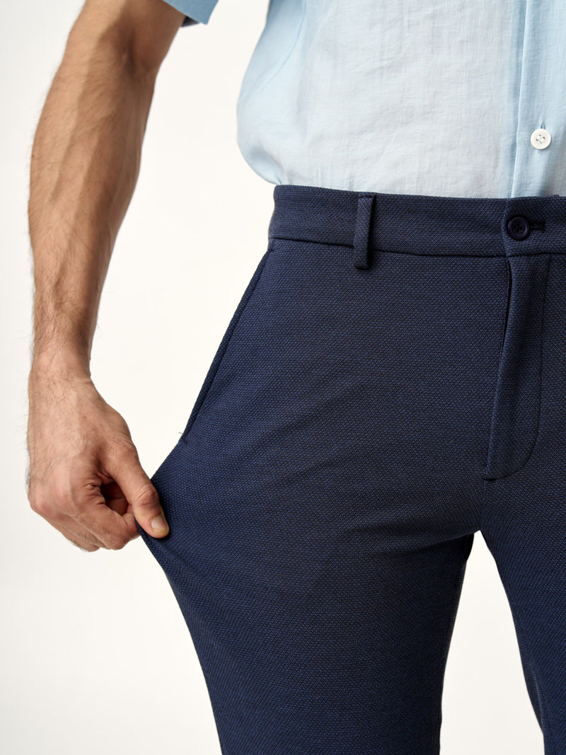 showing the stretch of sail blue custom pants from the Pant Project