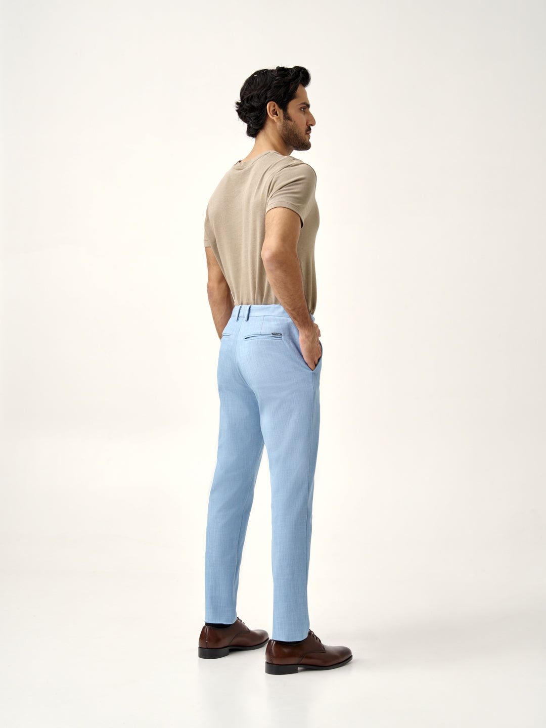 side back view of Pant Project's blue bali stretchable trousers