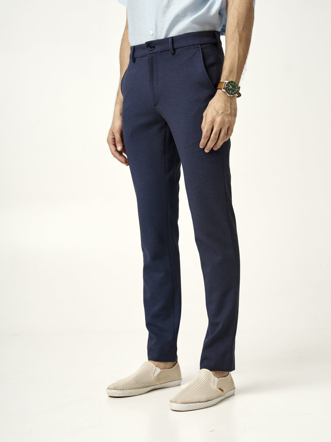 side view of man in the Pant Project sail blue pants and beige shoes