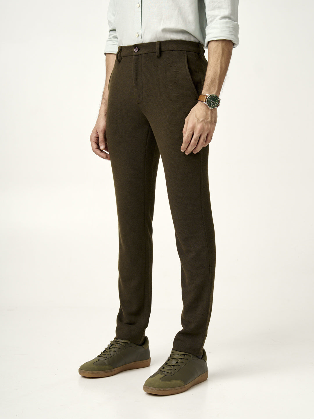 side view of model wearing olive green textured pants from the Pant Project 