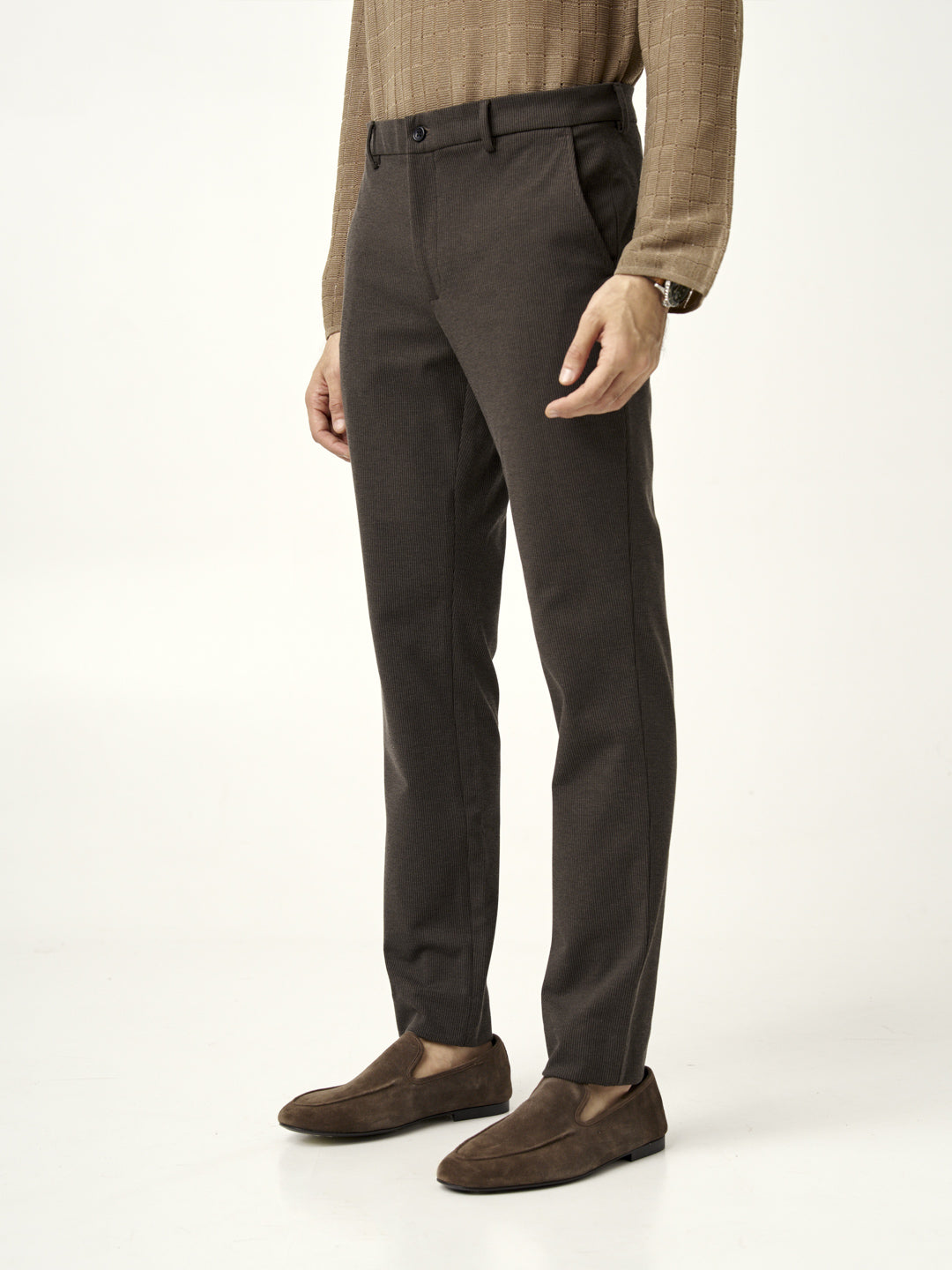 side view of walnut brown pants from the Pant Project, paired with brown loafers