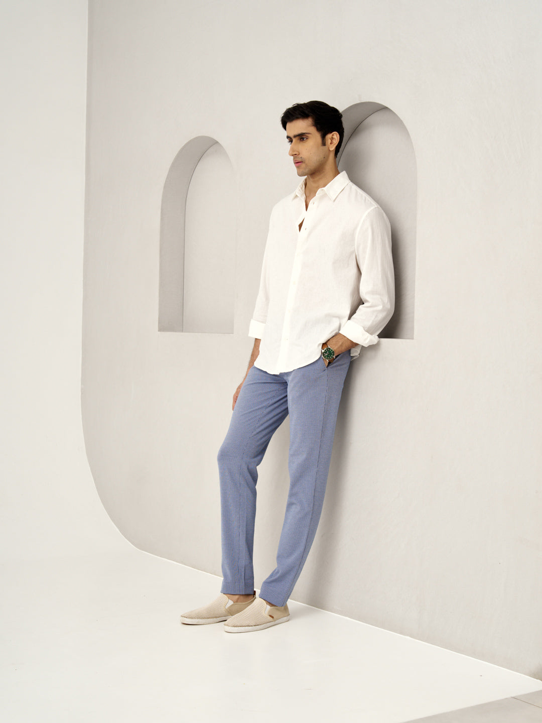 standing man in a white shirt wearing scottish blue pants by the Pant Project