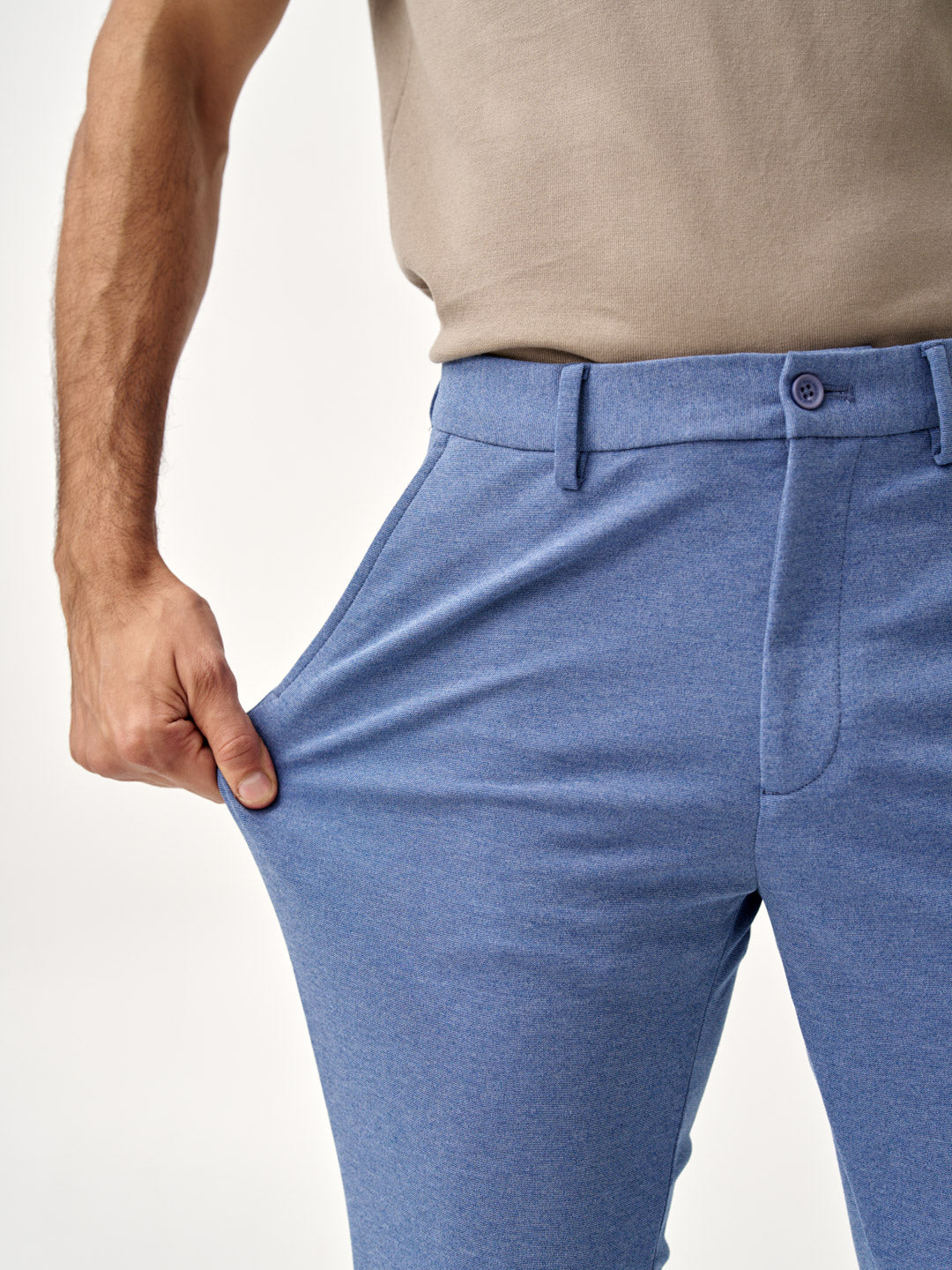 stretching ocean waves pants from the Pant Project, showing flexible fabric in close-up view