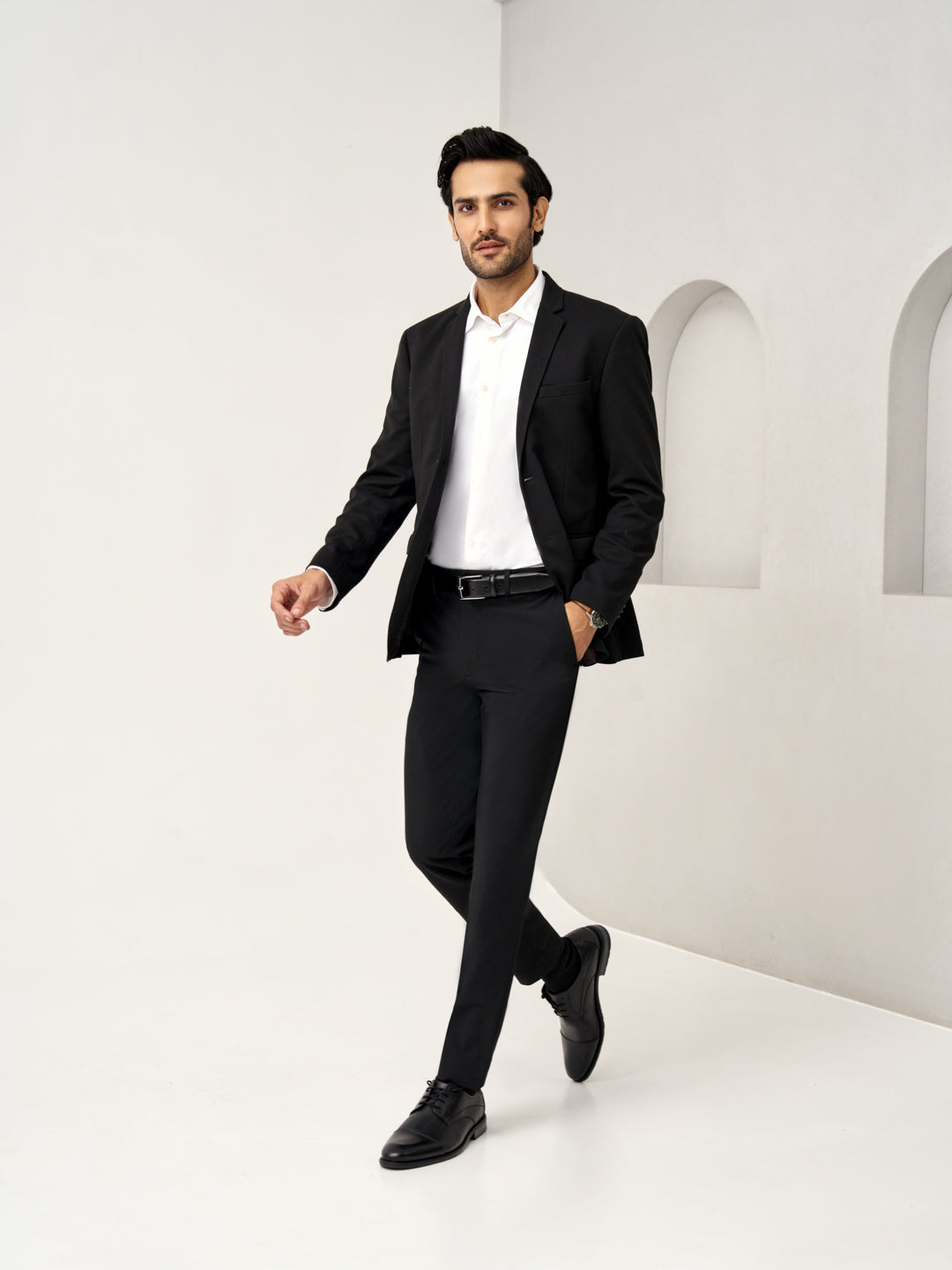 walking pose in Pant Project ebony black stretchable trousers