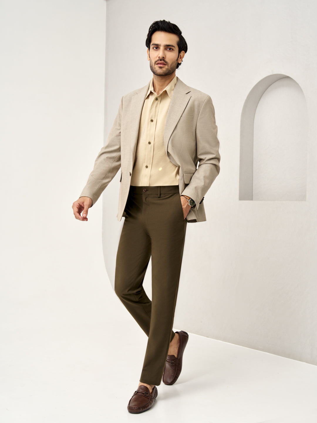  walking pose showcasing Pant Project olive green stretchable trousers