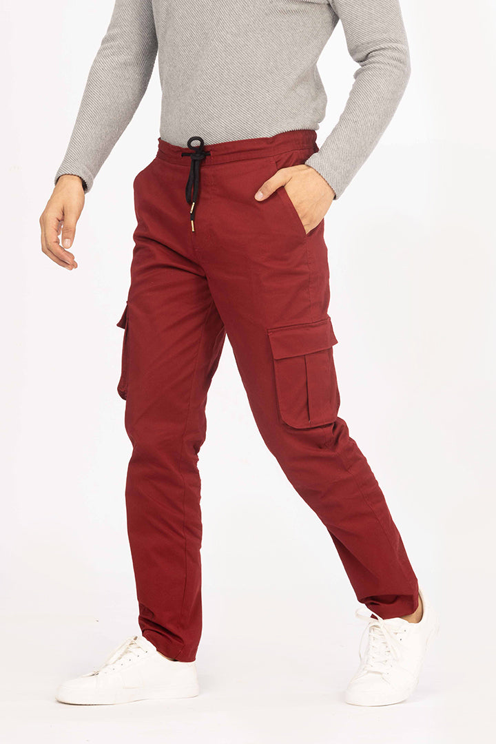 front view of red cargo jogger by pant project with pocket details