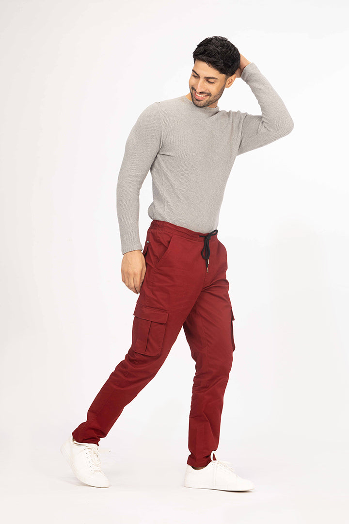 front view of red cargo joggers by pant project with casual fit