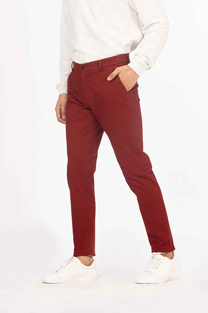 front view of red chino by pant project featuring casual fit