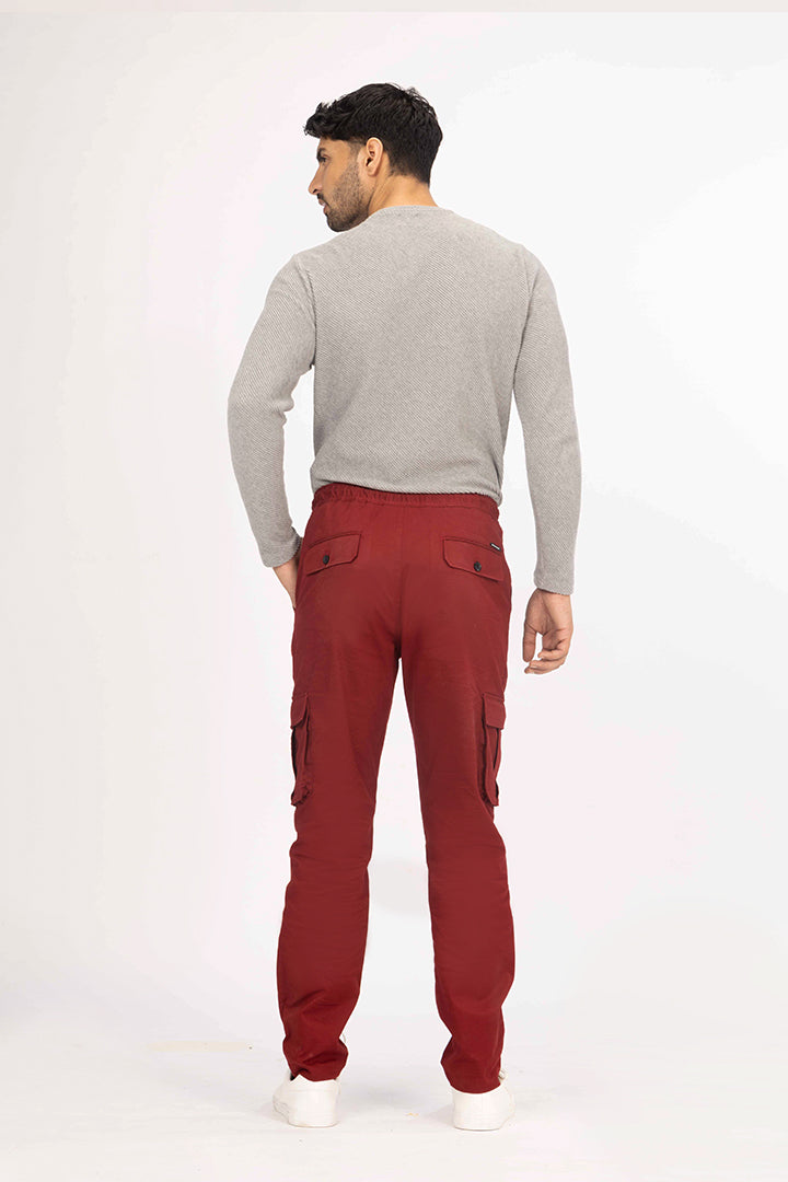 back view of red cargo pant by pant project featuring pocket details